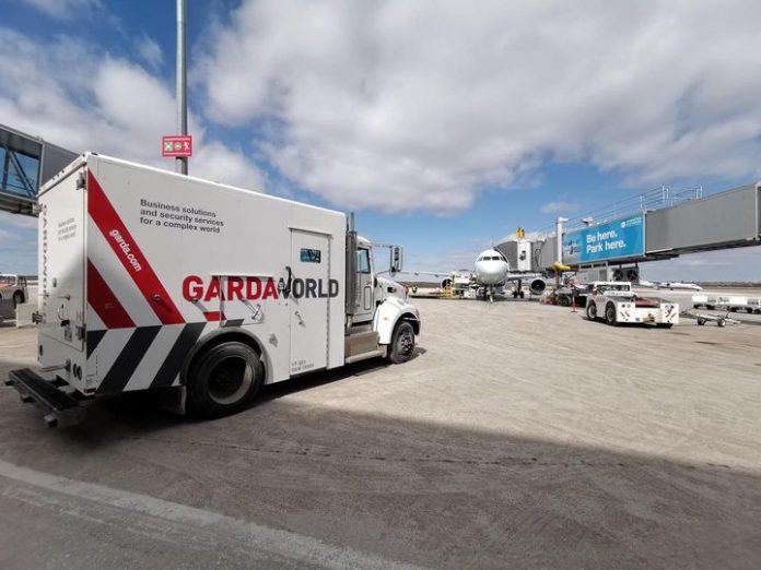 Garda World truck in an airport